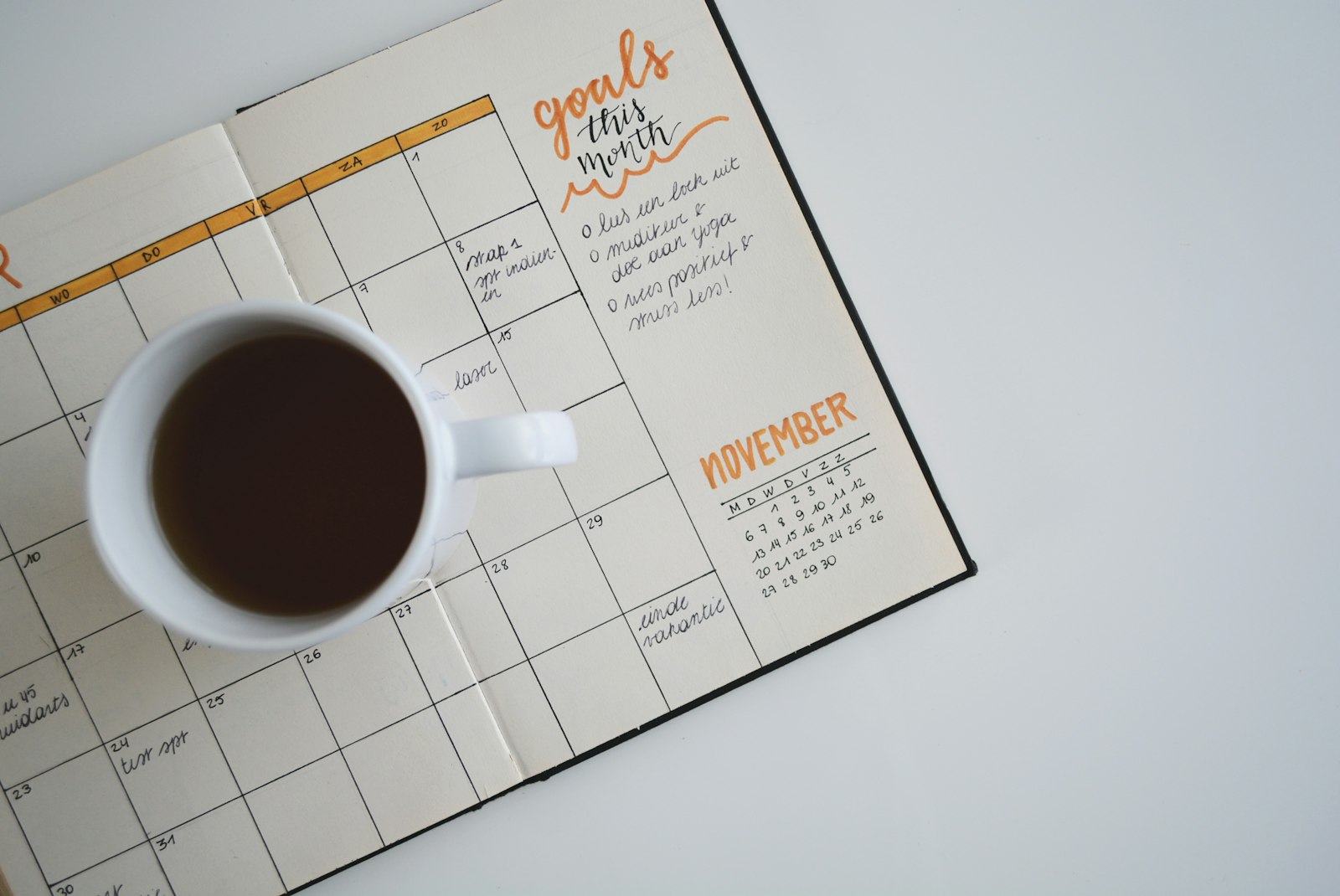 A paper planner calendar open on a desk